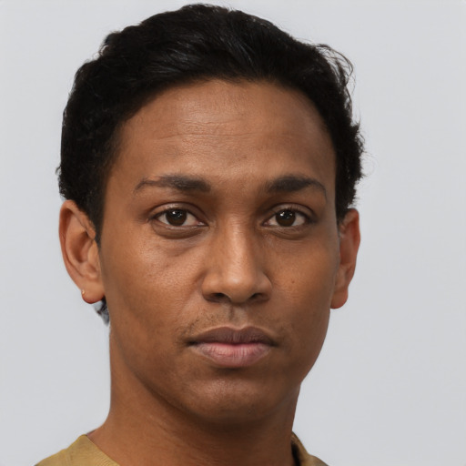 Neutral latino young-adult male with short  brown hair and brown eyes