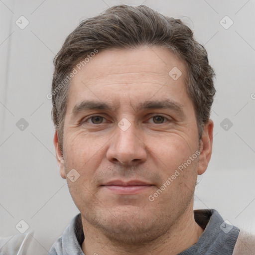 Joyful white adult male with short  brown hair and grey eyes