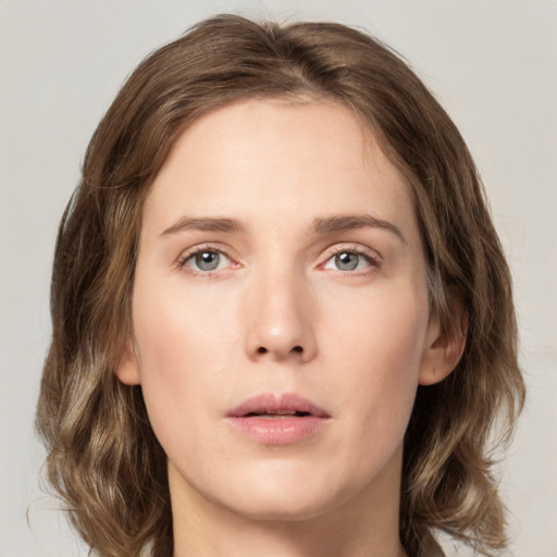 Neutral white young-adult female with medium  brown hair and green eyes