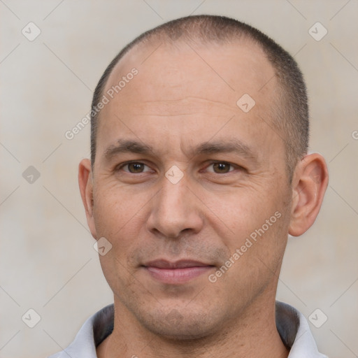 Joyful white adult male with short  brown hair and brown eyes