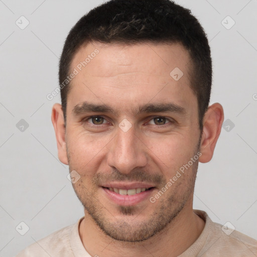 Joyful white young-adult male with short  brown hair and brown eyes