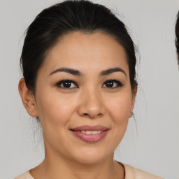 Joyful asian young-adult female with medium  brown hair and brown eyes