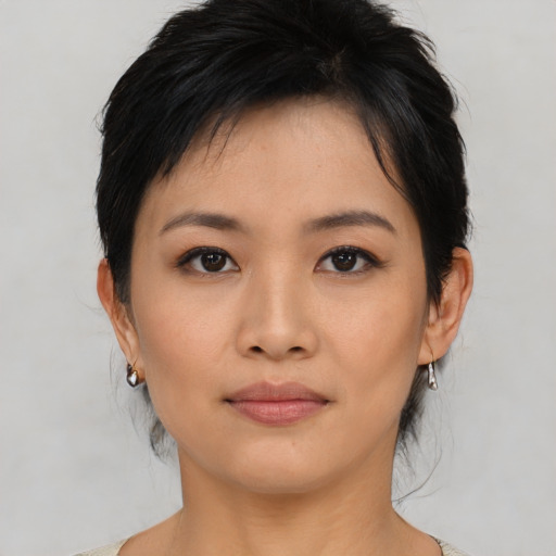Neutral asian young-adult female with medium  brown hair and brown eyes