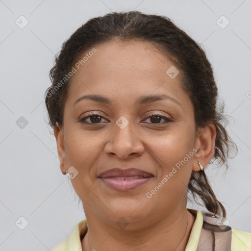 Joyful latino adult female with short  brown hair and brown eyes