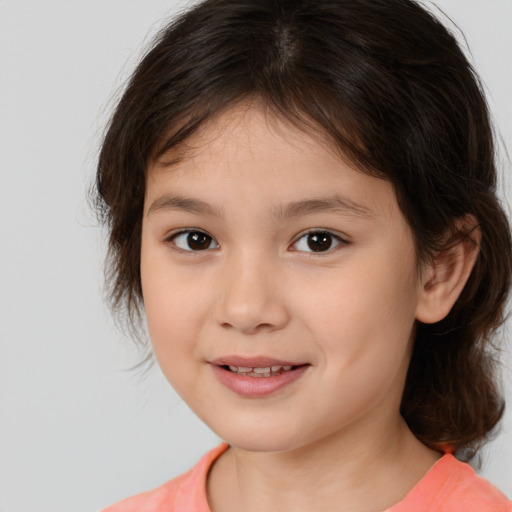 Joyful white child female with medium  brown hair and brown eyes
