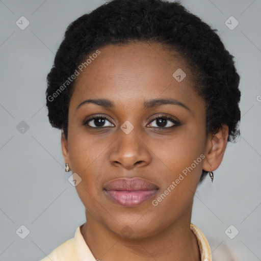 Joyful black young-adult female with short  black hair and brown eyes