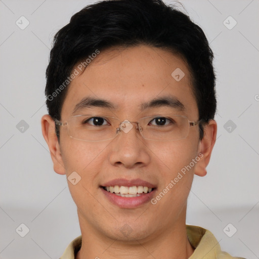 Joyful asian young-adult male with short  black hair and brown eyes