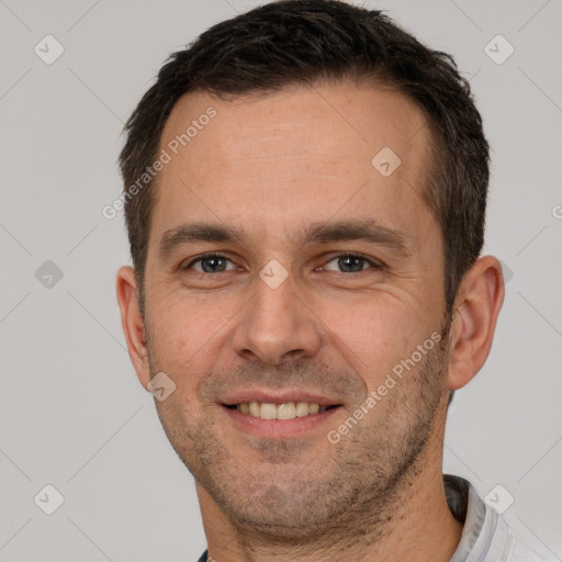 Joyful white adult male with short  brown hair and brown eyes