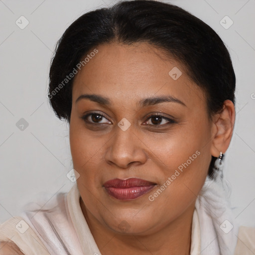 Joyful latino adult female with medium  brown hair and brown eyes