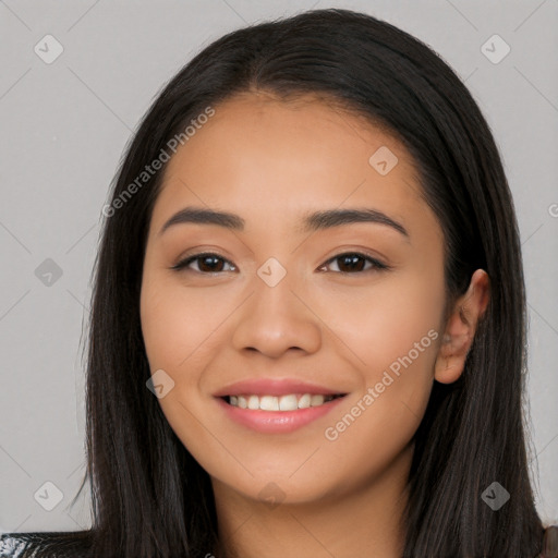 Joyful latino young-adult female with long  black hair and brown eyes