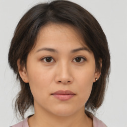 Neutral asian young-adult female with medium  brown hair and brown eyes