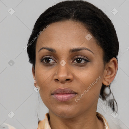 Joyful black young-adult female with medium  brown hair and brown eyes