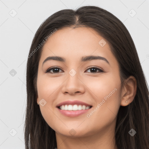 Joyful latino young-adult female with long  brown hair and brown eyes