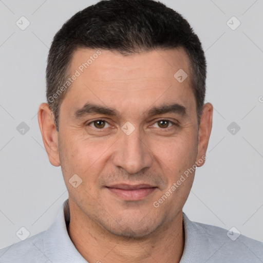 Joyful white adult male with short  brown hair and brown eyes