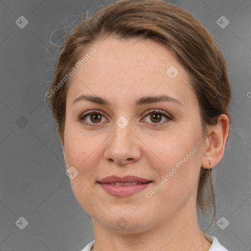 Joyful white young-adult female with medium  brown hair and grey eyes