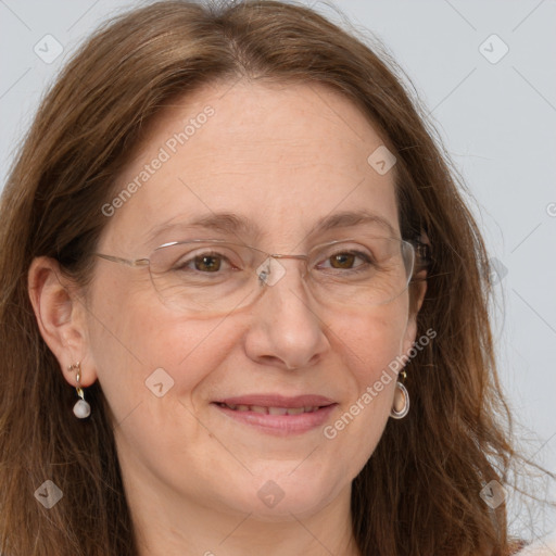 Joyful white adult female with long  brown hair and grey eyes