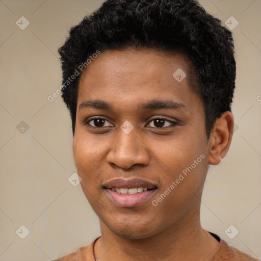 Joyful black young-adult male with short  black hair and brown eyes