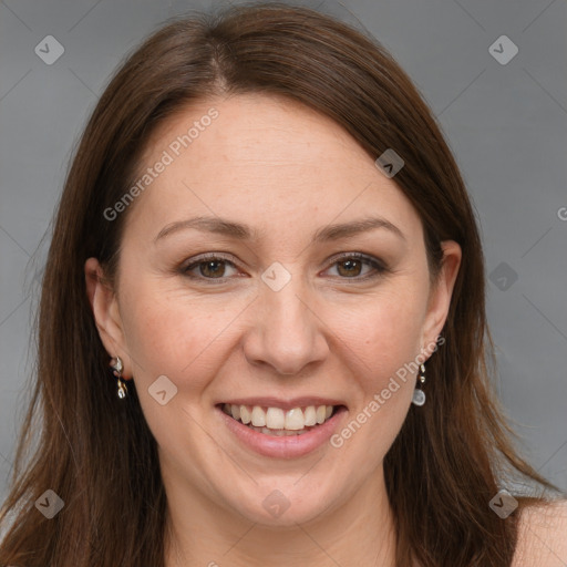 Joyful white adult female with long  brown hair and grey eyes