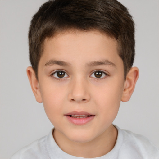 Joyful white child male with short  brown hair and brown eyes