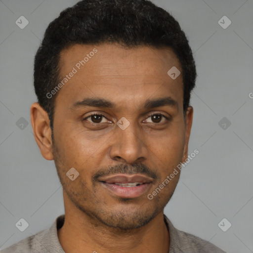 Joyful latino young-adult male with short  black hair and brown eyes
