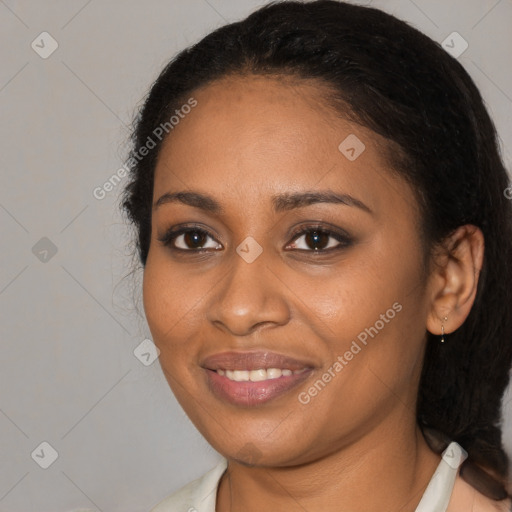 Joyful black young-adult female with medium  black hair and brown eyes