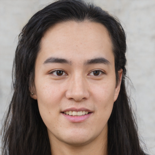 Joyful asian young-adult female with long  brown hair and brown eyes