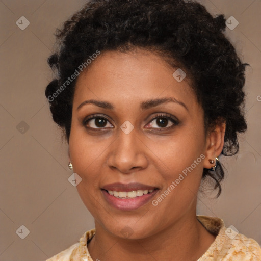 Joyful black young-adult female with short  brown hair and brown eyes