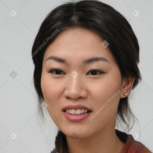 Joyful asian young-adult female with medium  black hair and brown eyes