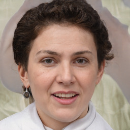 Joyful white adult female with short  brown hair and brown eyes