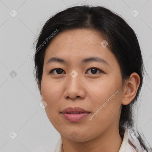 Joyful asian young-adult female with medium  brown hair and brown eyes