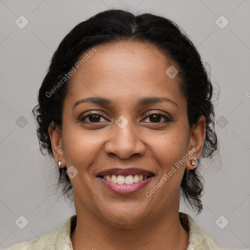 Joyful latino adult female with medium  brown hair and brown eyes