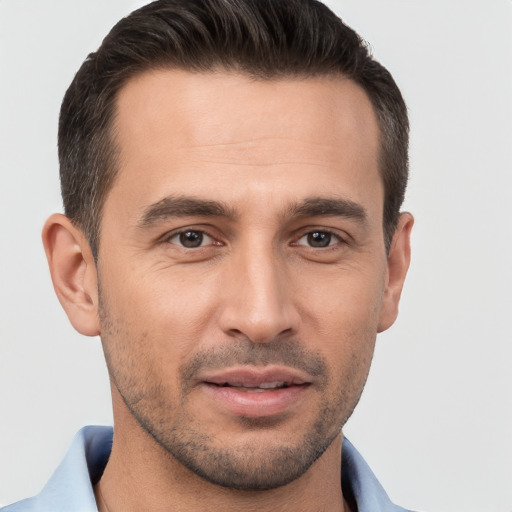 Joyful white young-adult male with short  brown hair and brown eyes