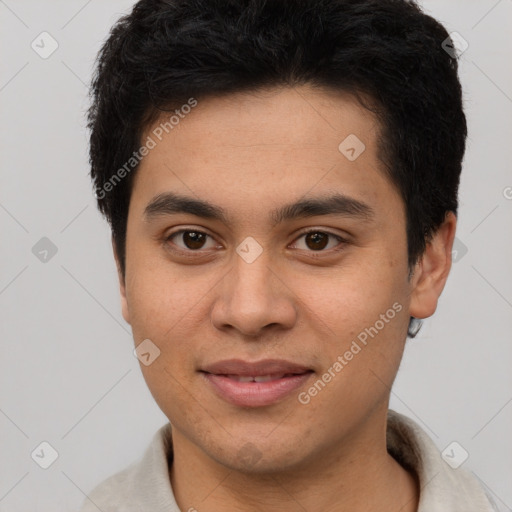 Joyful latino young-adult male with short  brown hair and brown eyes