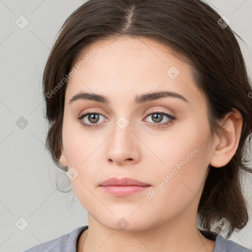 Neutral white young-adult female with medium  brown hair and brown eyes