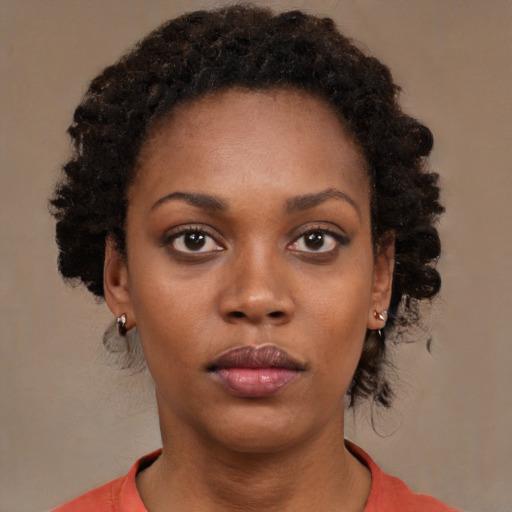 Neutral black young-adult female with short  brown hair and brown eyes