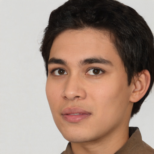 Neutral white young-adult male with short  black hair and brown eyes
