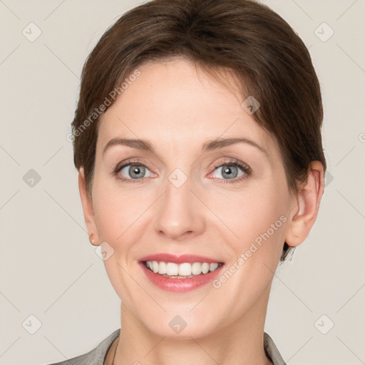 Joyful white young-adult female with short  brown hair and grey eyes