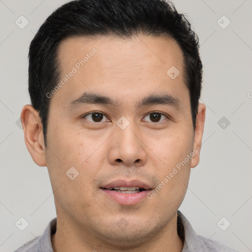 Joyful latino young-adult male with short  black hair and brown eyes