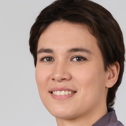 Joyful white young-adult female with medium  brown hair and brown eyes