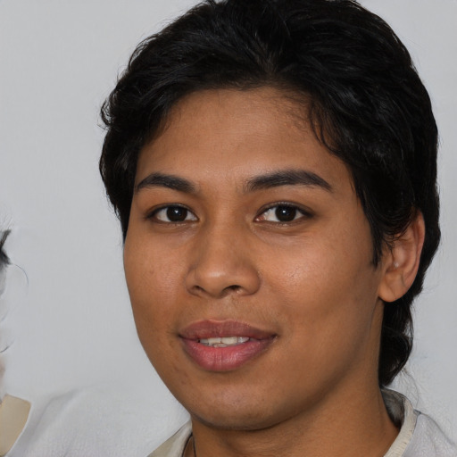 Joyful asian young-adult female with medium  brown hair and brown eyes
