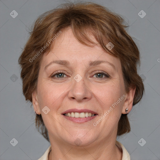 Joyful white adult female with medium  brown hair and grey eyes