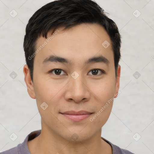 Joyful asian young-adult male with short  black hair and brown eyes