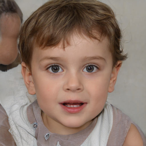 Joyful white child male with short  brown hair and brown eyes