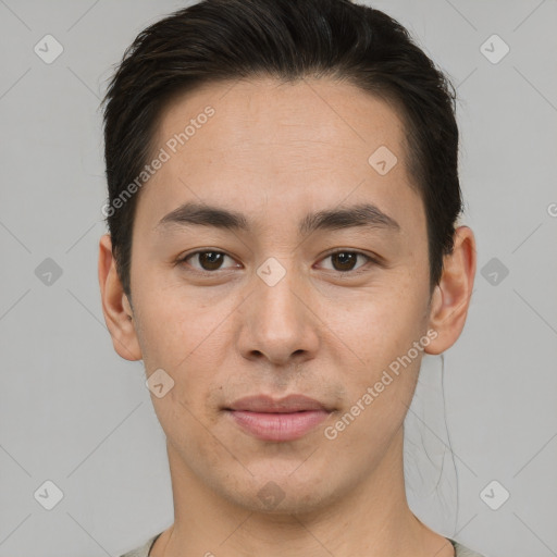 Joyful asian young-adult male with short  brown hair and brown eyes