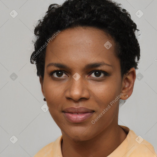 Joyful black young-adult female with short  black hair and brown eyes