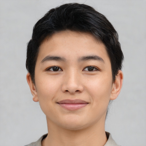Joyful asian young-adult male with short  black hair and brown eyes