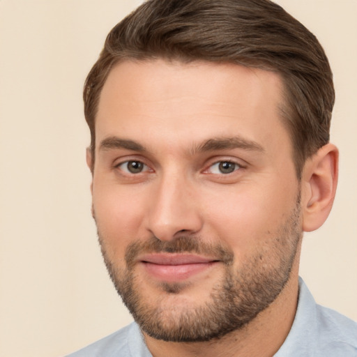 Joyful white young-adult male with short  brown hair and brown eyes