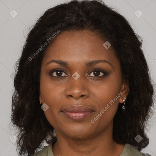 Joyful black young-adult female with medium  brown hair and brown eyes