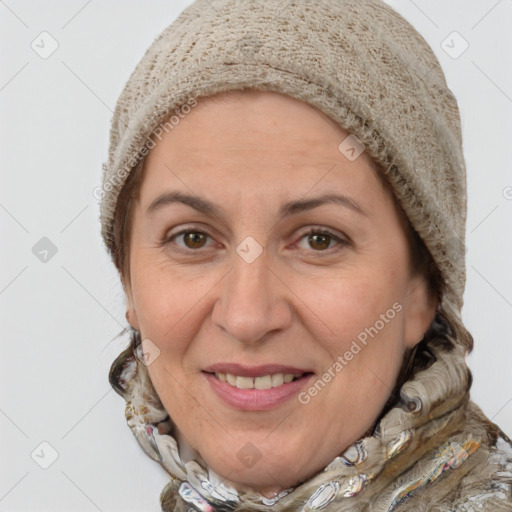 Joyful white adult female with short  brown hair and grey eyes