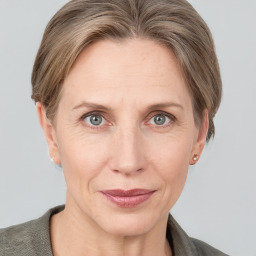 Joyful white adult female with short  brown hair and grey eyes